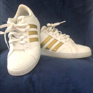 Vintage gold Adidas tennis shoes